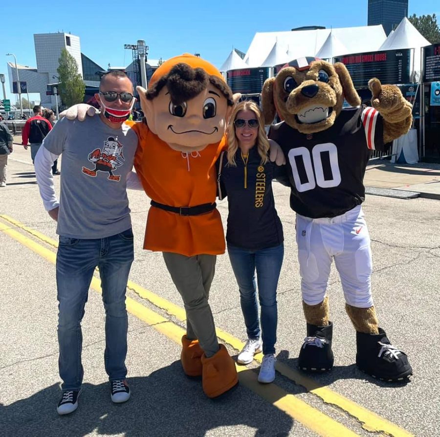English teacher Megan Rumsey captures a moment at the NFL draft in Cleveland May 1 with her husband, Jeff Rumsey, and the Browns and Steelers mascots.