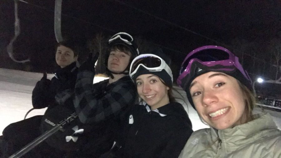 Senior+Delaney+Maglionico+and+sophomores+Sophia+Maglionico+and+Tyler+Paul+ride+the+ski+lift+up+the+slopes.